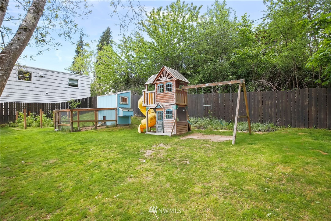 3604 Madrona Street Bremerton, WA 98312 - Photo 32 of 37 a view of a house with a backyard and a tree