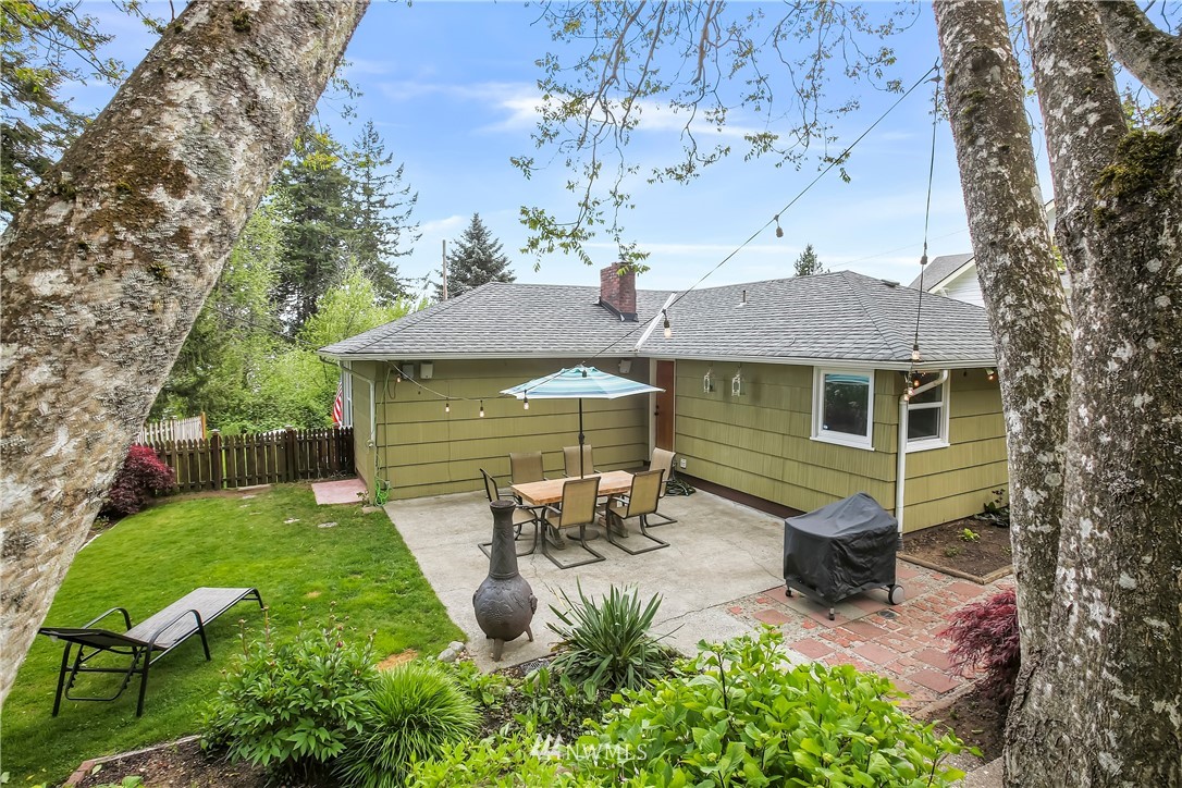 3604 Madrona Street Bremerton, WA 98312 - Photo 33 of 37 a view of a house with backyard sitting area and garden