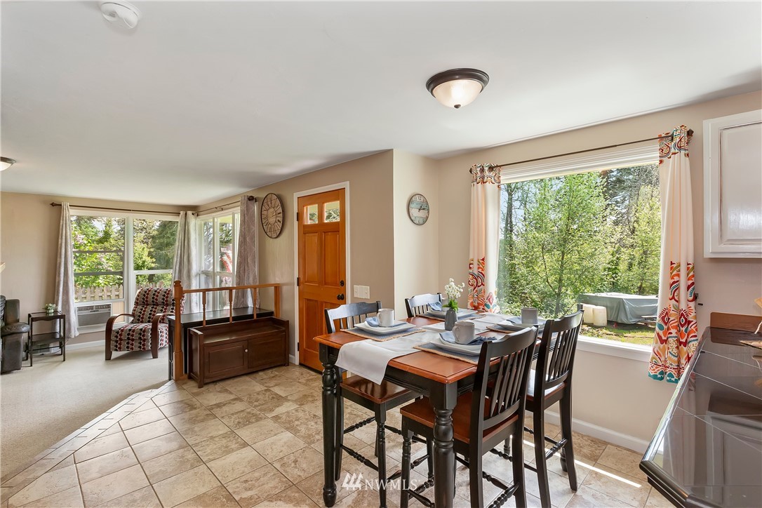 3604 Madrona Street Bremerton, WA 98312 - Photo 8 of 37 a dining room with furniture and large windows