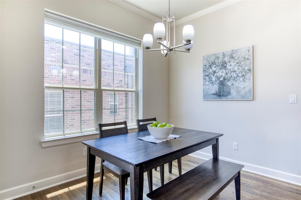 5005 Meridian Lane, Unit 3102 Addison, TX 75001 - Photo 17 of 34 a view of a dining room with furniture window and wooden floor