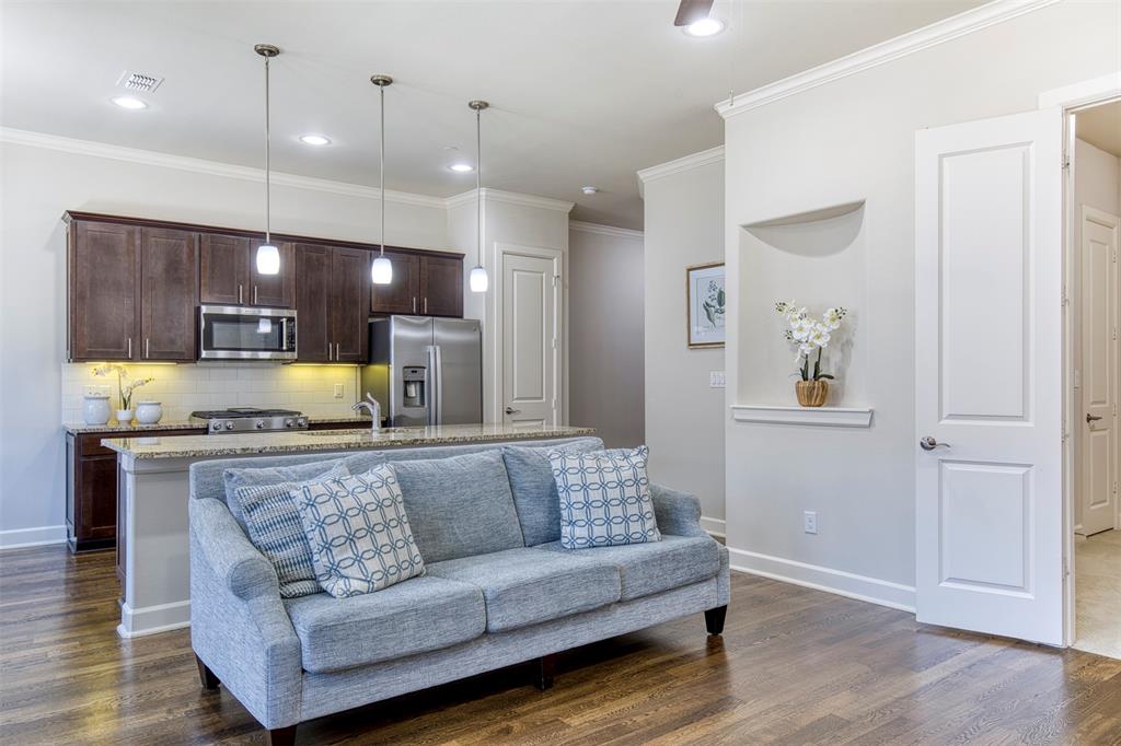 5005 Meridian Lane, Unit 3102 Addison, TX 75001 - Photo 19 of 34 a living room with furniture and kitchen view