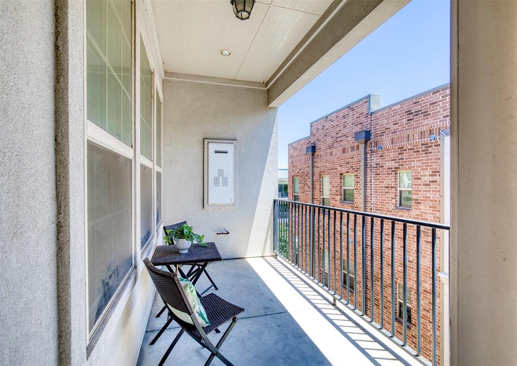 5005 Meridian Lane, Unit 3102 Addison, TX 75001 - Photo 24 of 34 a view of a balcony with furniture