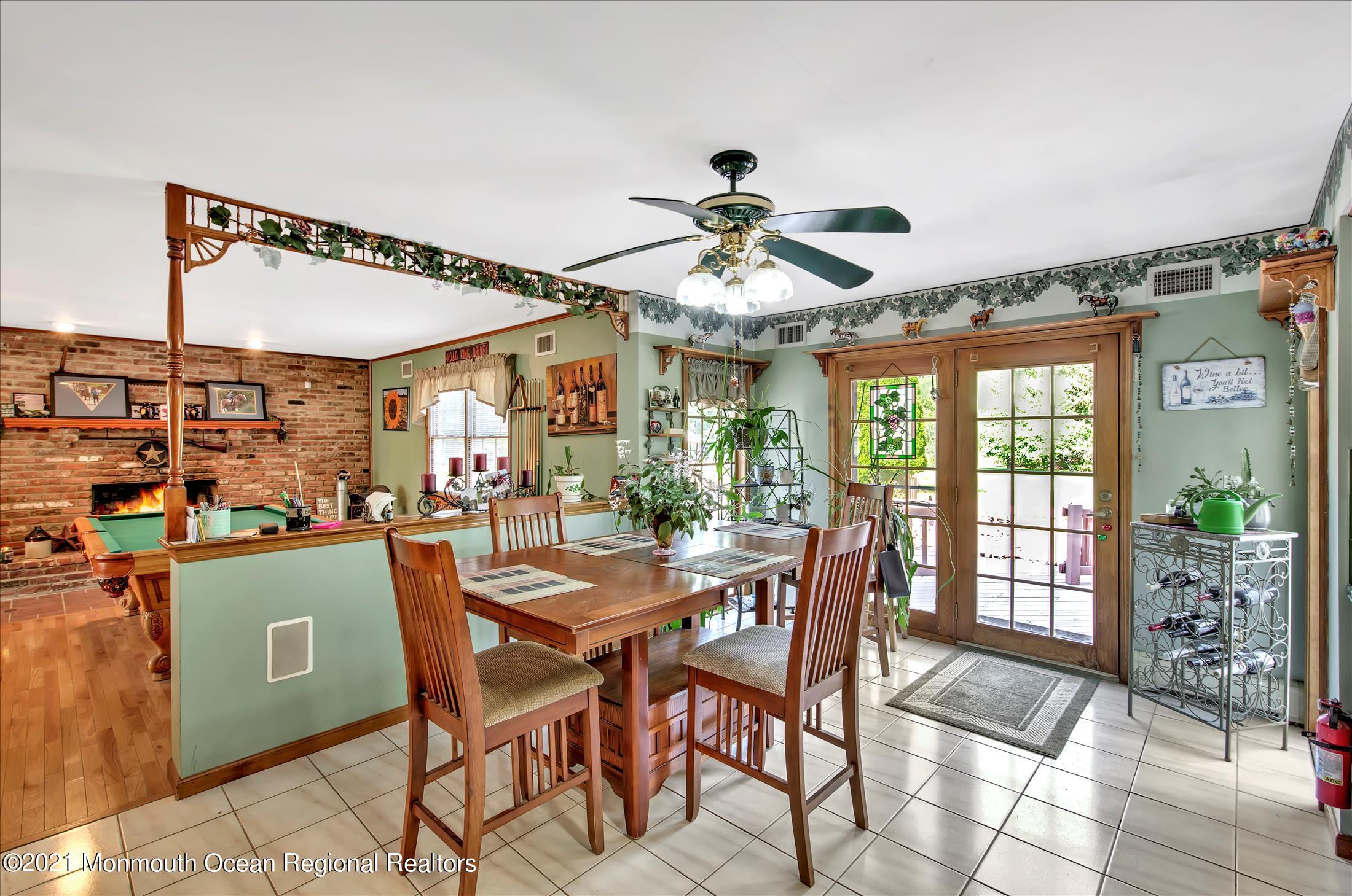 58 Brookside Road Millstone Township, NJ 08510 - Photo 12 of 34 a view of a dining room with furniture window and outside view