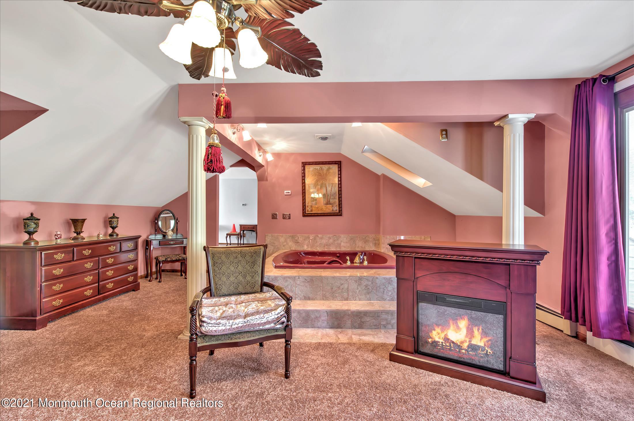 58 Brookside Road Millstone Township, NJ 08510 - Photo 18 of 34 a living room with furniture and a fireplace
