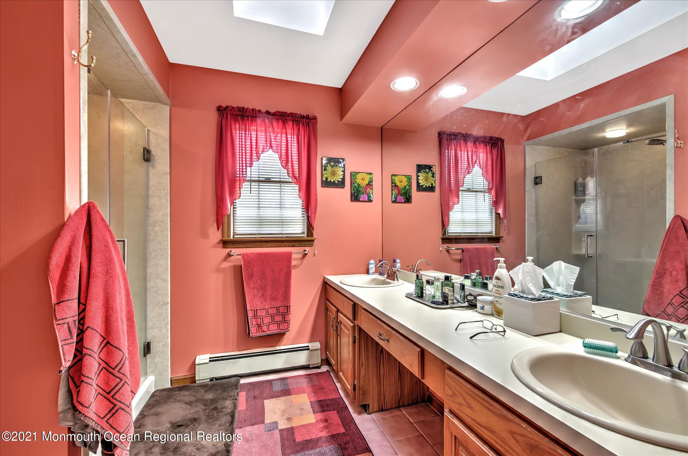 58 Brookside Road Millstone Township, NJ 08510 - Photo 23 of 34 a bathroom with a sink and a mirror
