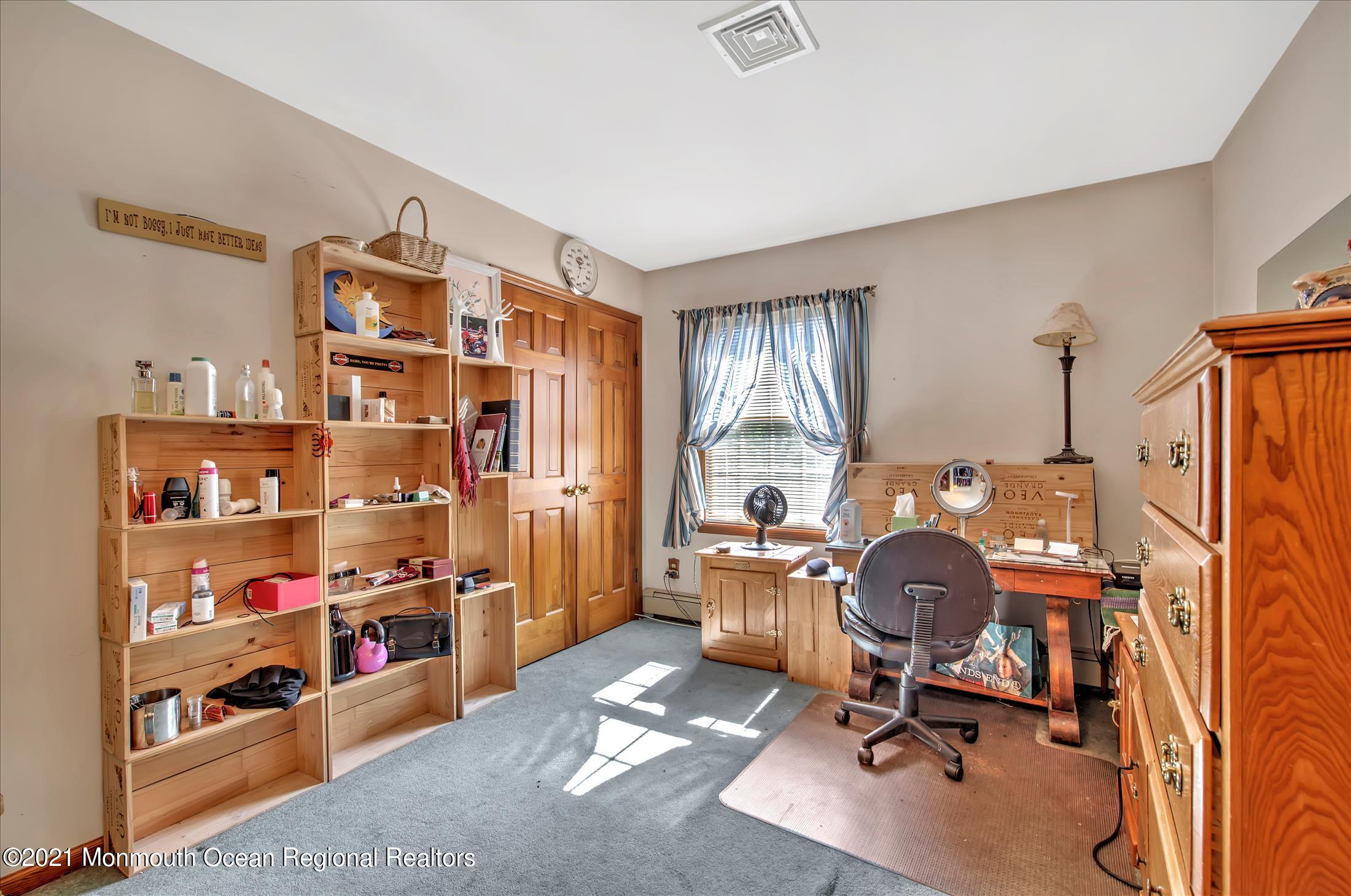 58 Brookside Road Millstone Township, NJ 08510 - Photo 24 of 34 a view of a workspace with furniture and a window