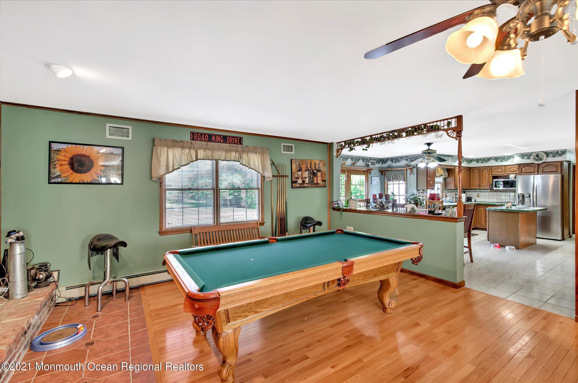 58 Brookside Road Millstone Township, NJ 08510 - Photo 7 of 34 a room with pool table and windows