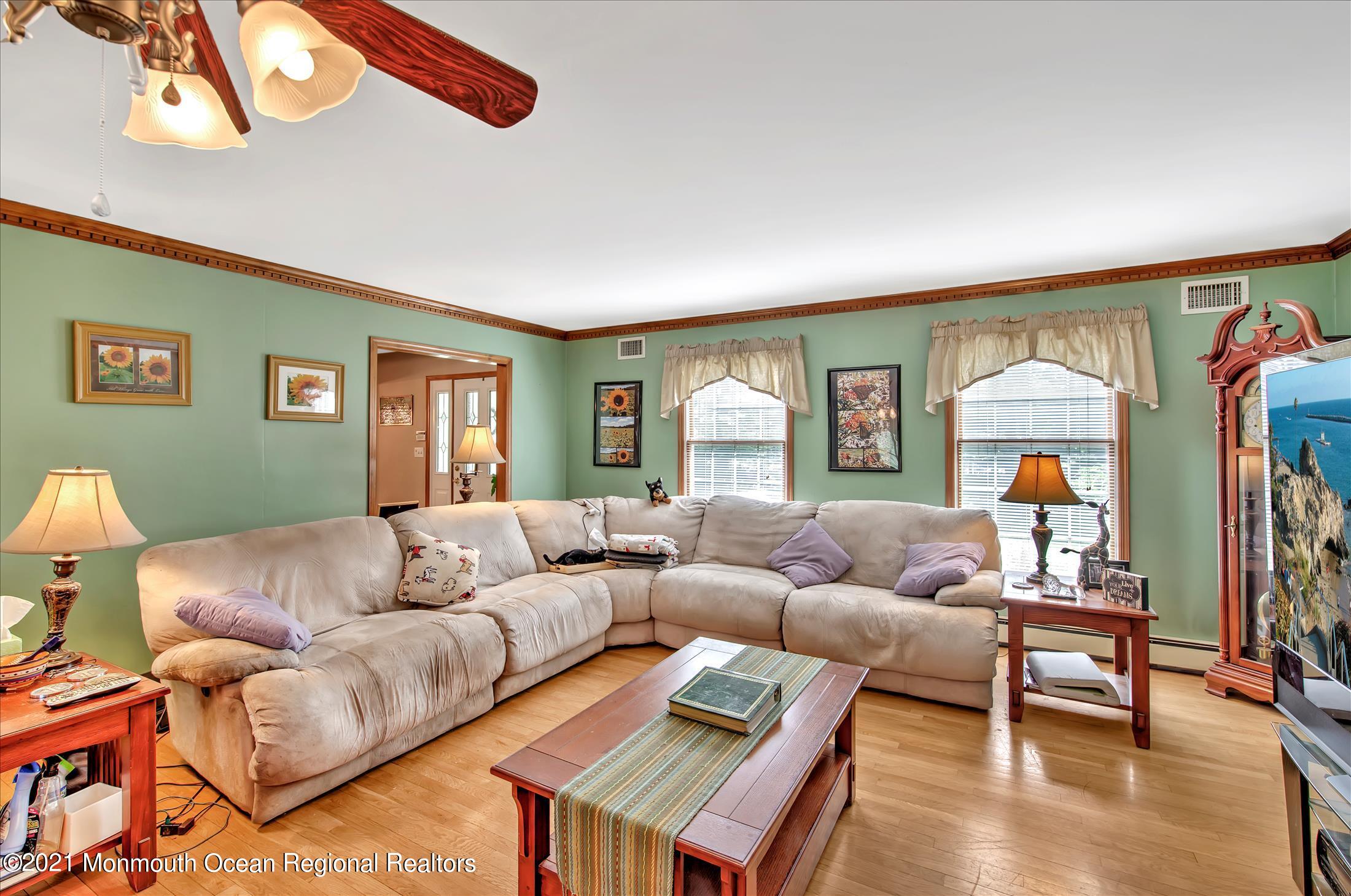 58 Brookside Road Millstone Township, NJ 08510 - Photo 10 of 34 a living room with furniture and a window