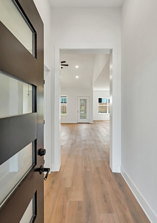 9904 Ridings Drive Waco, TX 76708 - Photo 2 of 37 a view of a hallway with wooden floor
