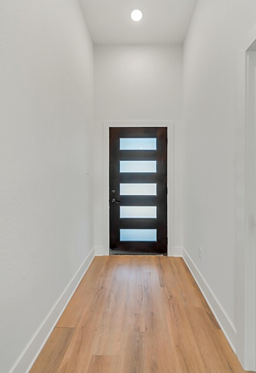 9904 Ridings Drive Waco, TX 76708 - Photo 3 of 37 a view of a room with wooden floor and window