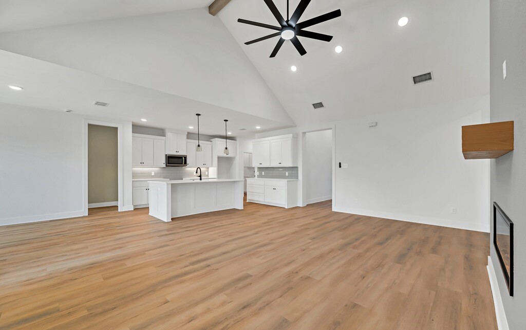 9904 Ridings Drive Waco, TX 76708 - Photo 8 of 37 a view of a kitchen with a sink and dishwasher a refrigerator with wooden floor