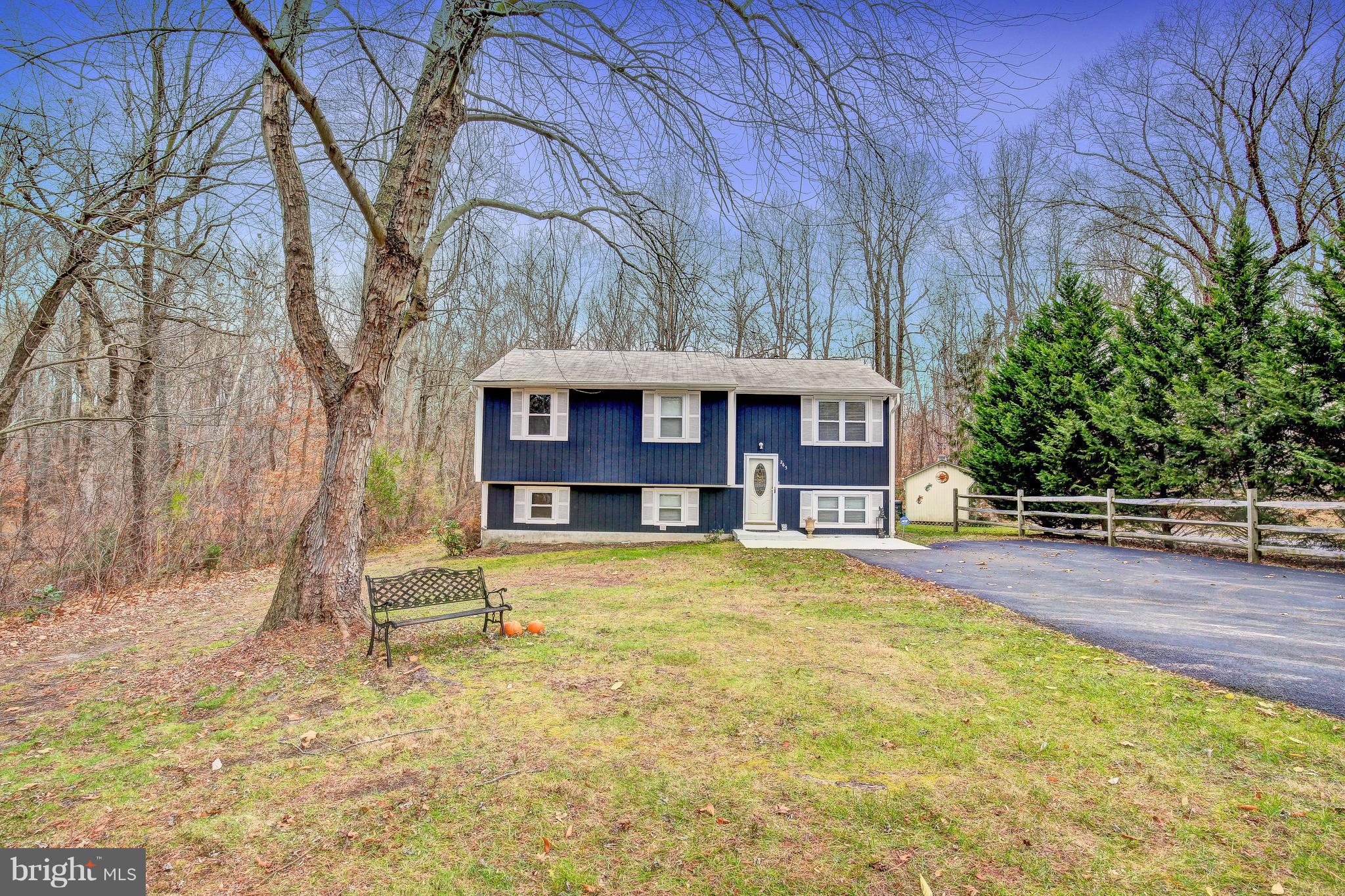 265 Chesapeake Beach Road Owings, MD 20736 - Photo 1 of 30 a front view of a house with a yard
