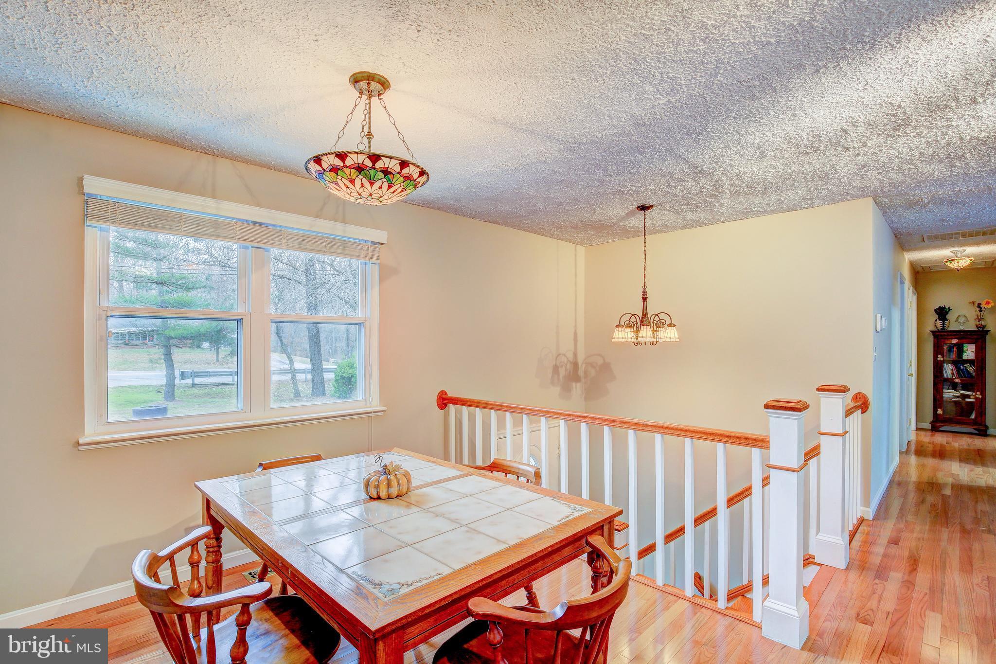 265 Chesapeake Beach Road Owings, MD 20736 - Photo 13 of 30 a view of a livingroom with furniture wooden floor and windows