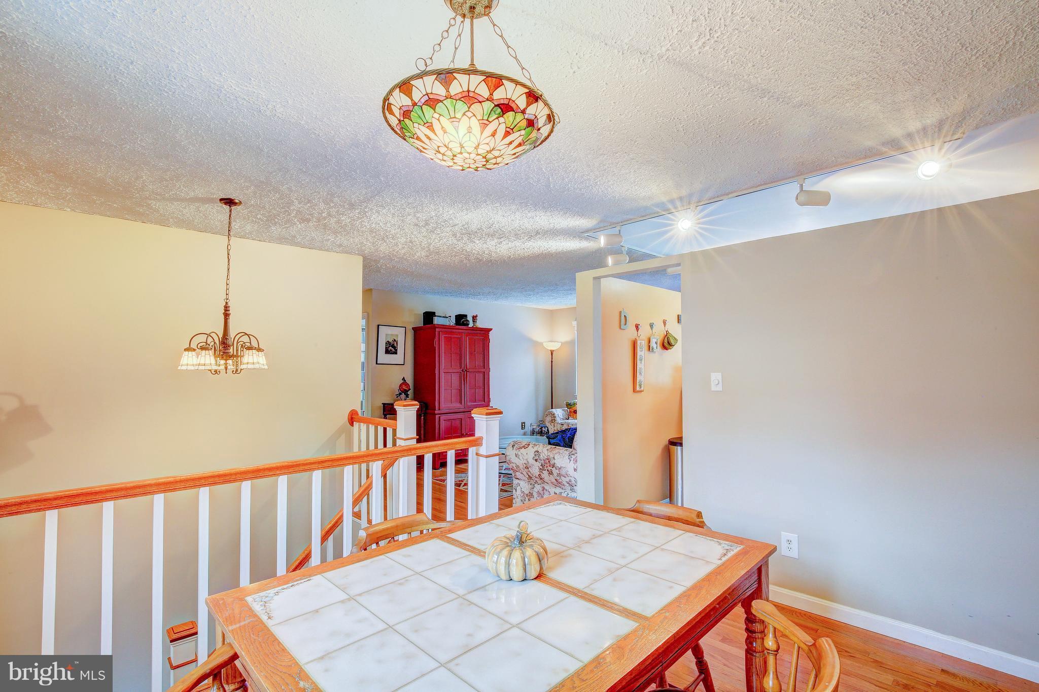 265 Chesapeake Beach Road Owings, MD 20736 - Photo 14 of 30 a view of a hallway with a dining table chairs
