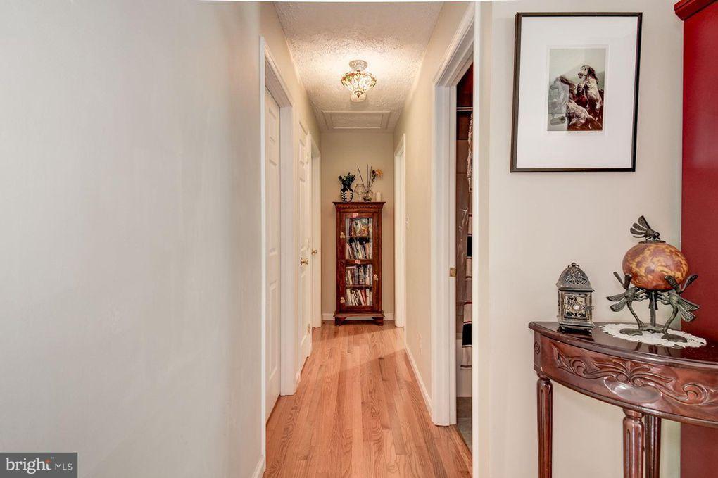 265 Chesapeake Beach Road Owings, MD 20736 - Photo 15 of 30 a view of a hallway with paintings on the wall