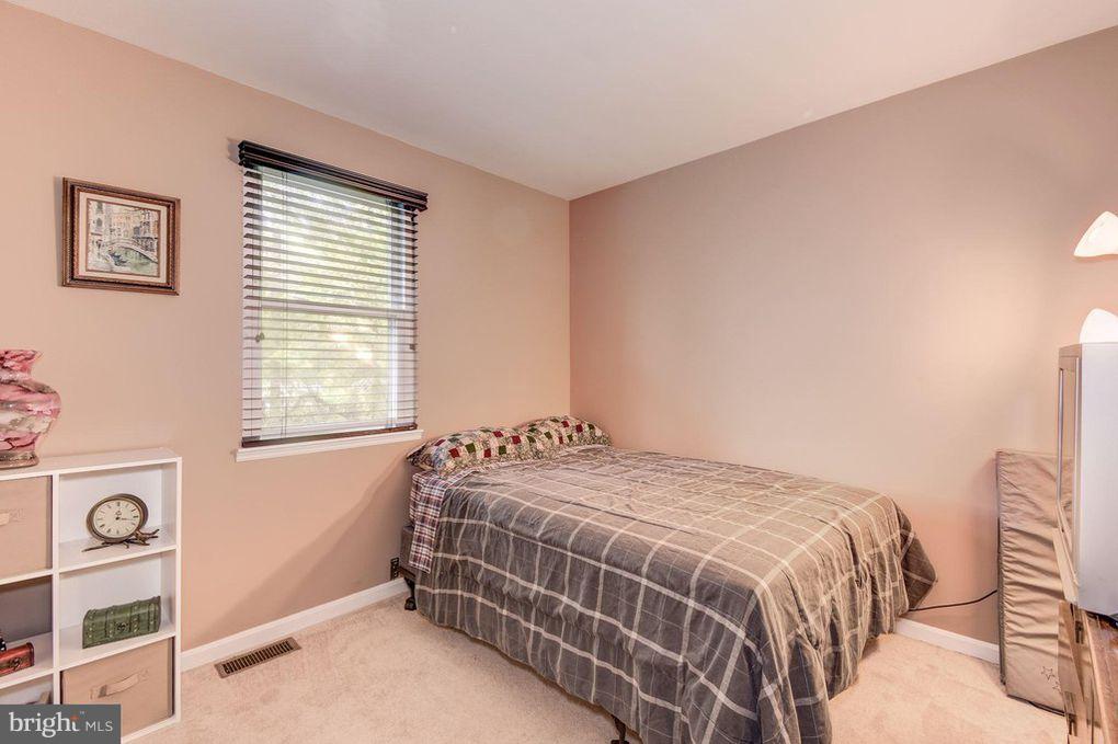 265 Chesapeake Beach Road Owings, MD 20736 - Photo 17 of 30 a bedroom with a bed and a window