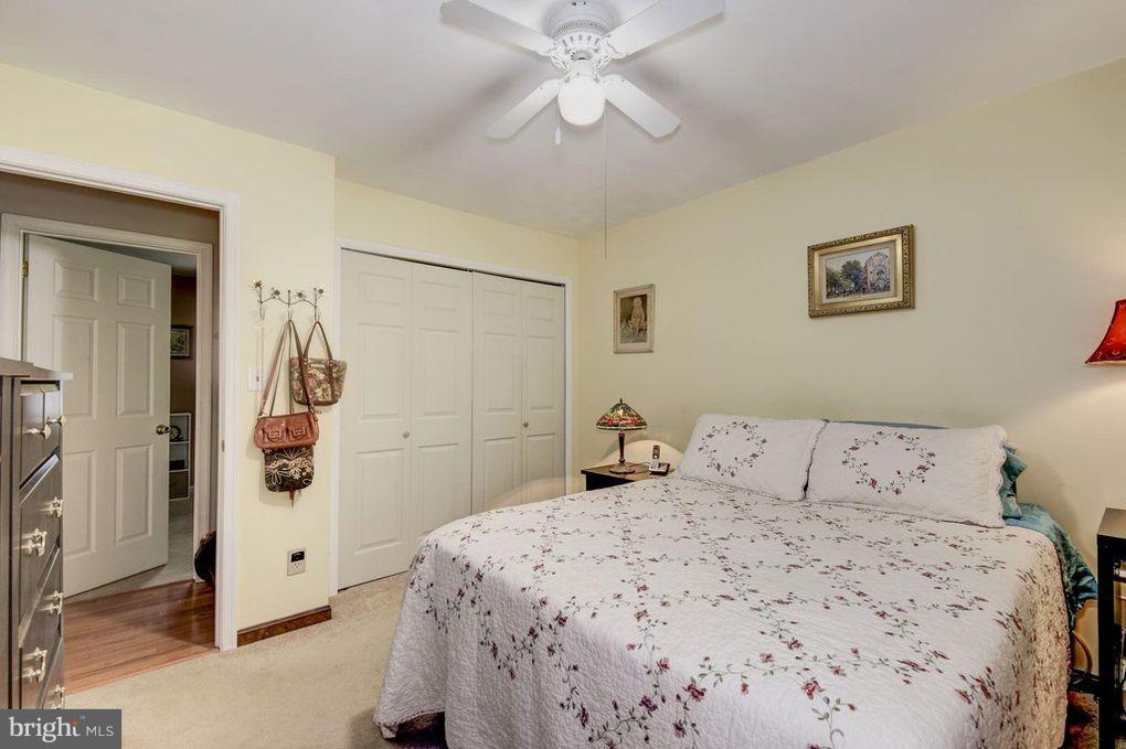 265 Chesapeake Beach Road Owings, MD 20736 - Photo 19 of 30 a bedroom with a bed and a walk in closet