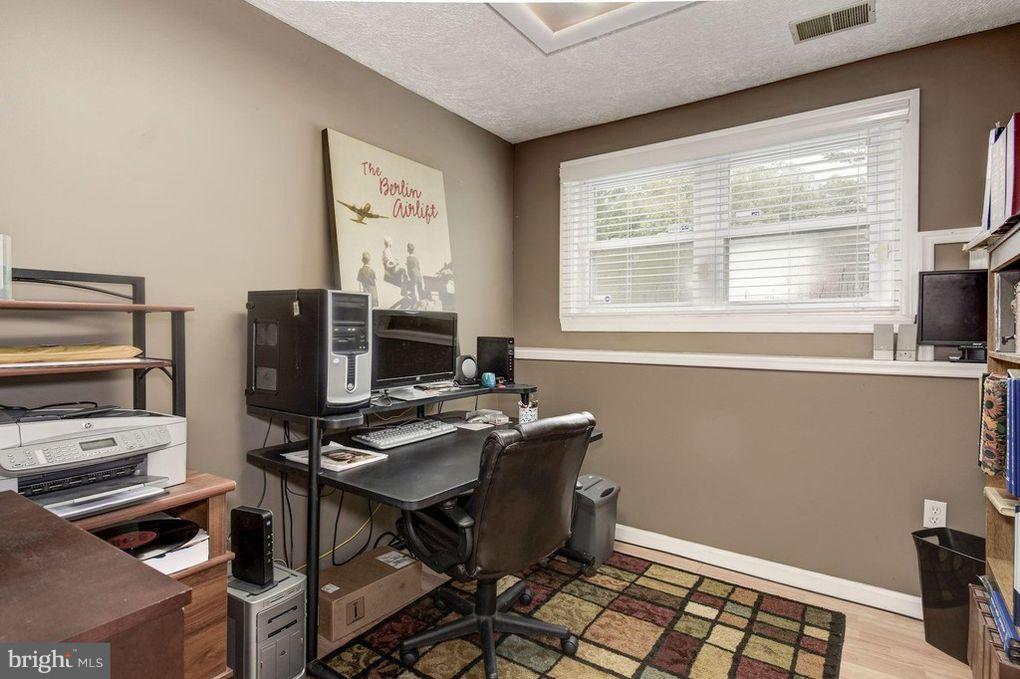 265 Chesapeake Beach Road Owings, MD 20736 - Photo 23 of 30 a view of a workspace with furniture and a window