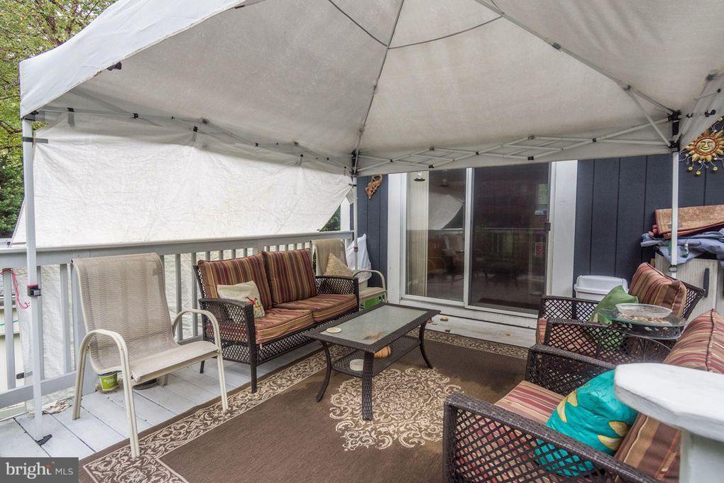 265 Chesapeake Beach Road Owings, MD 20736 - Photo 24 of 30 a building outdoor space with patio furniture and potted plants