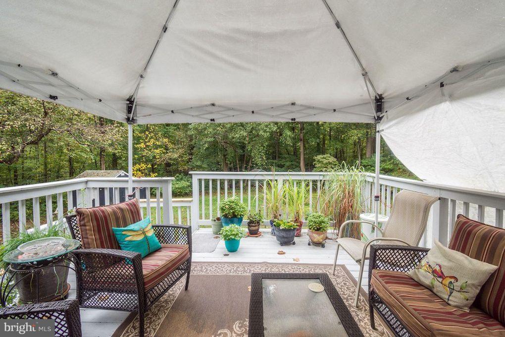 265 Chesapeake Beach Road Owings, MD 20736 - Photo 25 of 30 a view of a chair and tables in the balcony