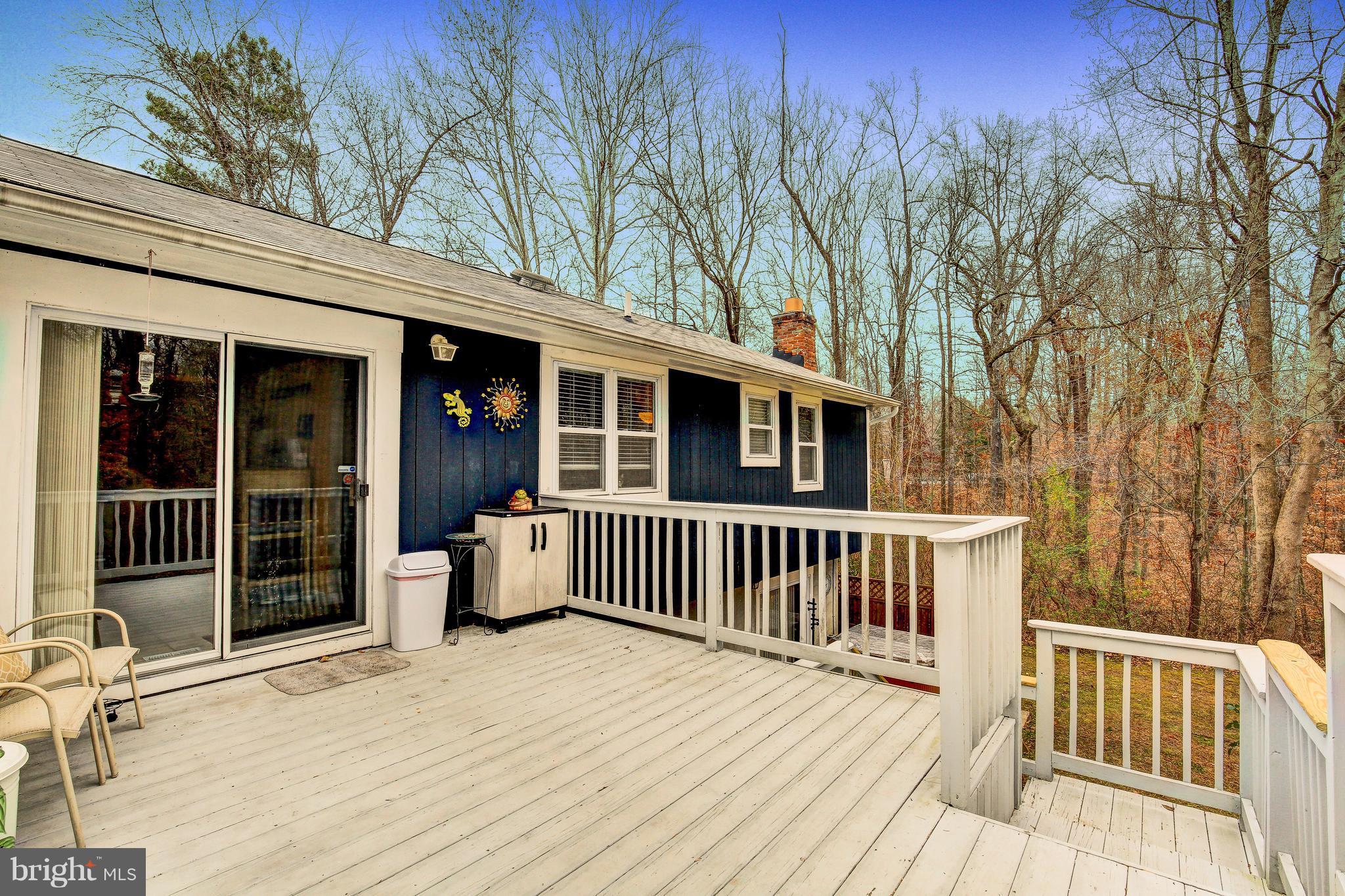 265 Chesapeake Beach Road Owings, MD 20736 - Photo 27 of 30 a view of a house with a wooden deck