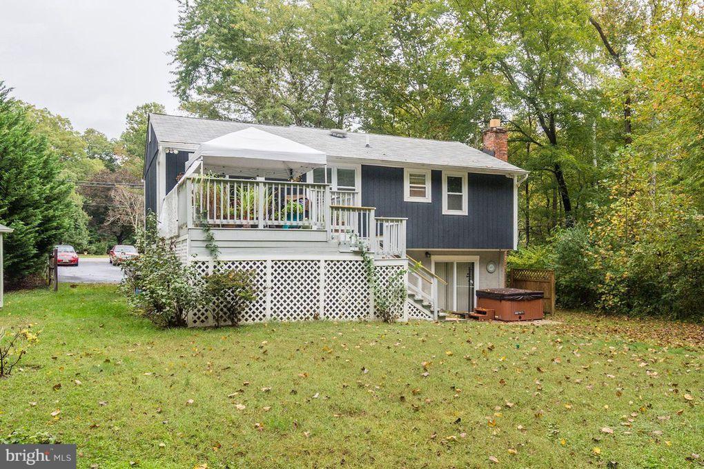 265 Chesapeake Beach Road Owings, MD 20736 - Photo 4 of 30 a front view of a house with a garden