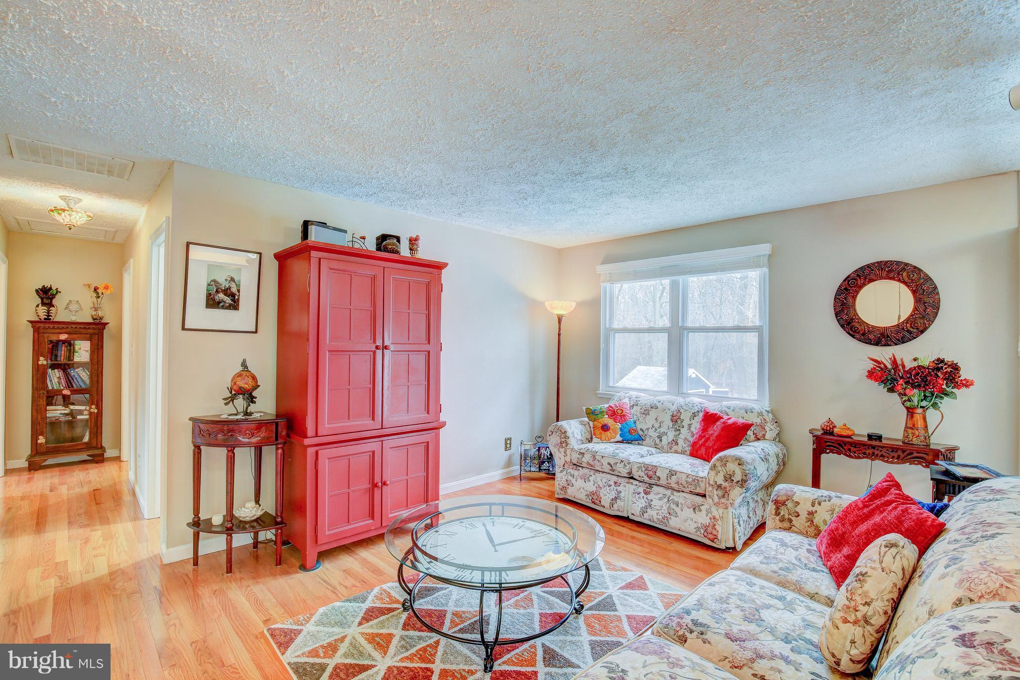 265 Chesapeake Beach Road Owings, MD 20736 - Photo 8 of 30 a living room with furniture and wooden floor