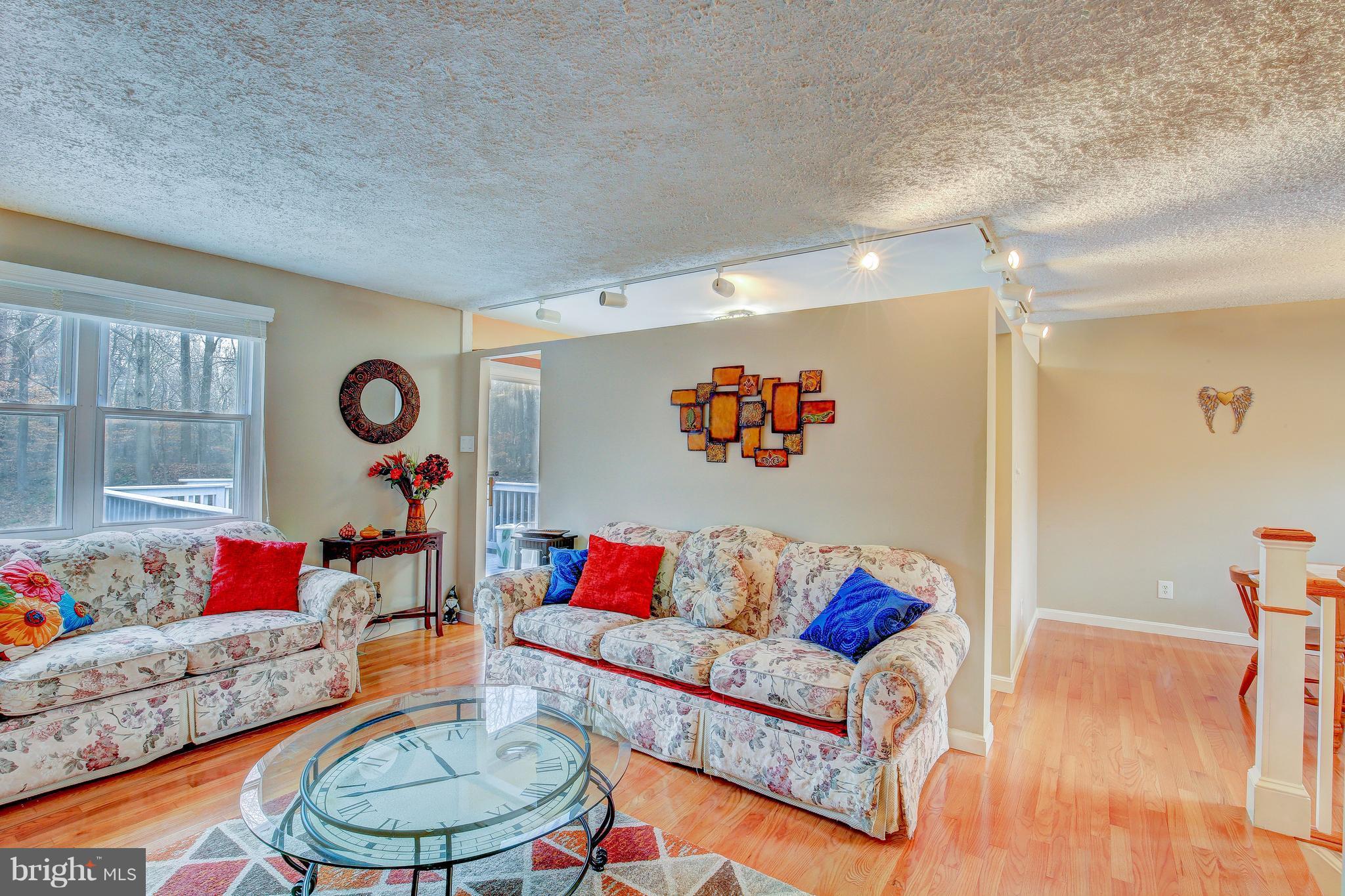 265 Chesapeake Beach Road Owings, MD 20736 - Photo 9 of 30 a living room with furniture and a table