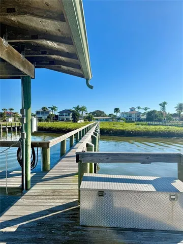 a view of a balcony with two chairs and a stove