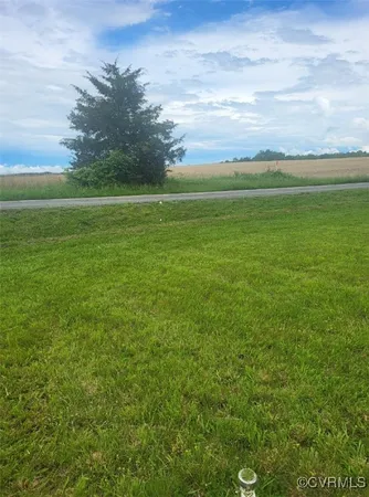 a view of a green field with clear sky