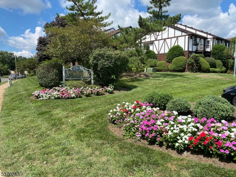 73 Farm Road Hillsborough, NJ 08844 - Photo 1 of 26 a front view of a house with a yard and fountain