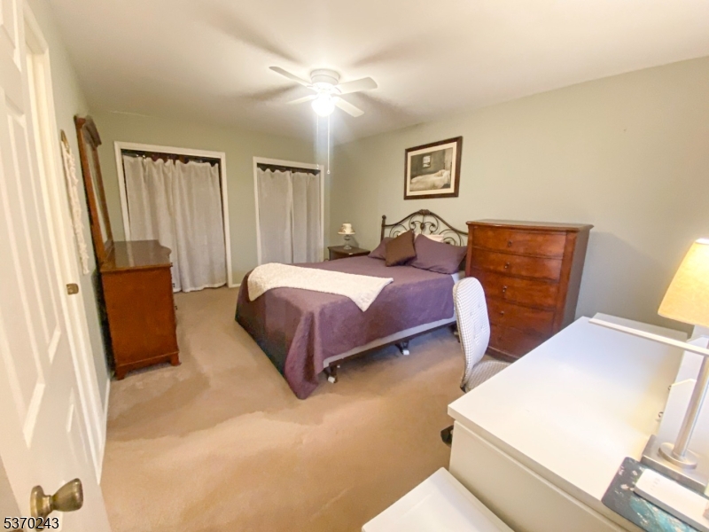 73 Farm Road Hillsborough, NJ 08844 - Photo 12 of 26 a bedroom with a bed and a couch