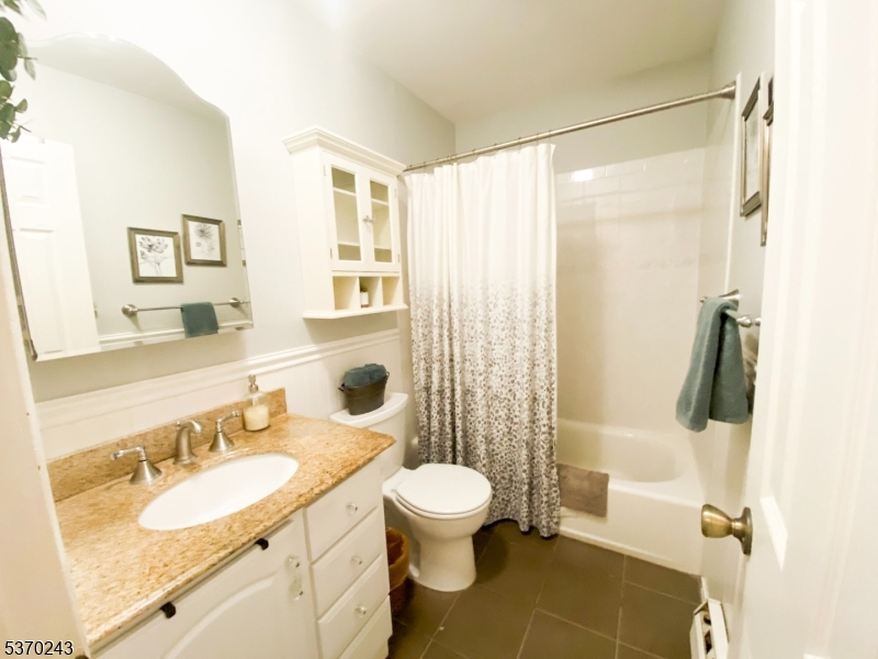 73 Farm Road Hillsborough, NJ 08844 - Photo 14 of 26 a bathroom with a granite countertop sink toilet a mirror and shower