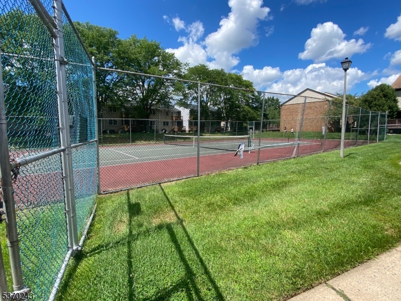 73 Farm Road Hillsborough, NJ 08844 - Photo 23 of 26 a view of a backyard with wooden fence