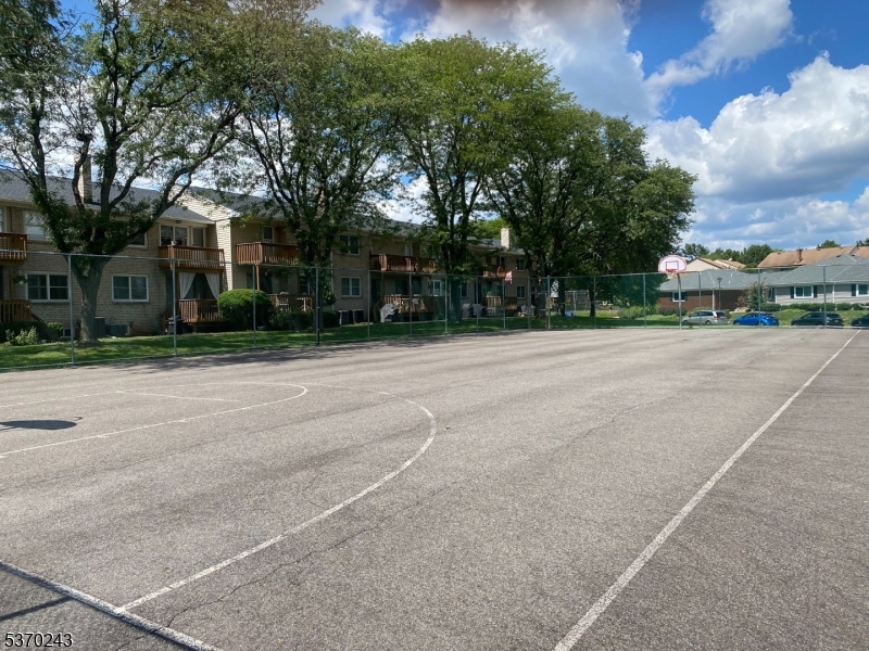 73 Farm Road Hillsborough, NJ 08844 - Photo 24 of 26 a backyard of a house with large trees and outdoor seating