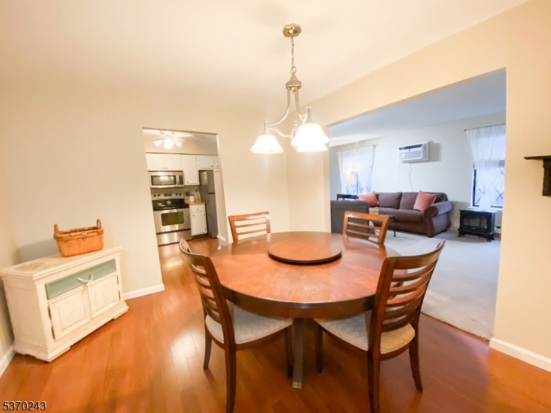 73 Farm Road Hillsborough, NJ 08844 - Photo 7 of 26 a dining room with furniture and wooden floor