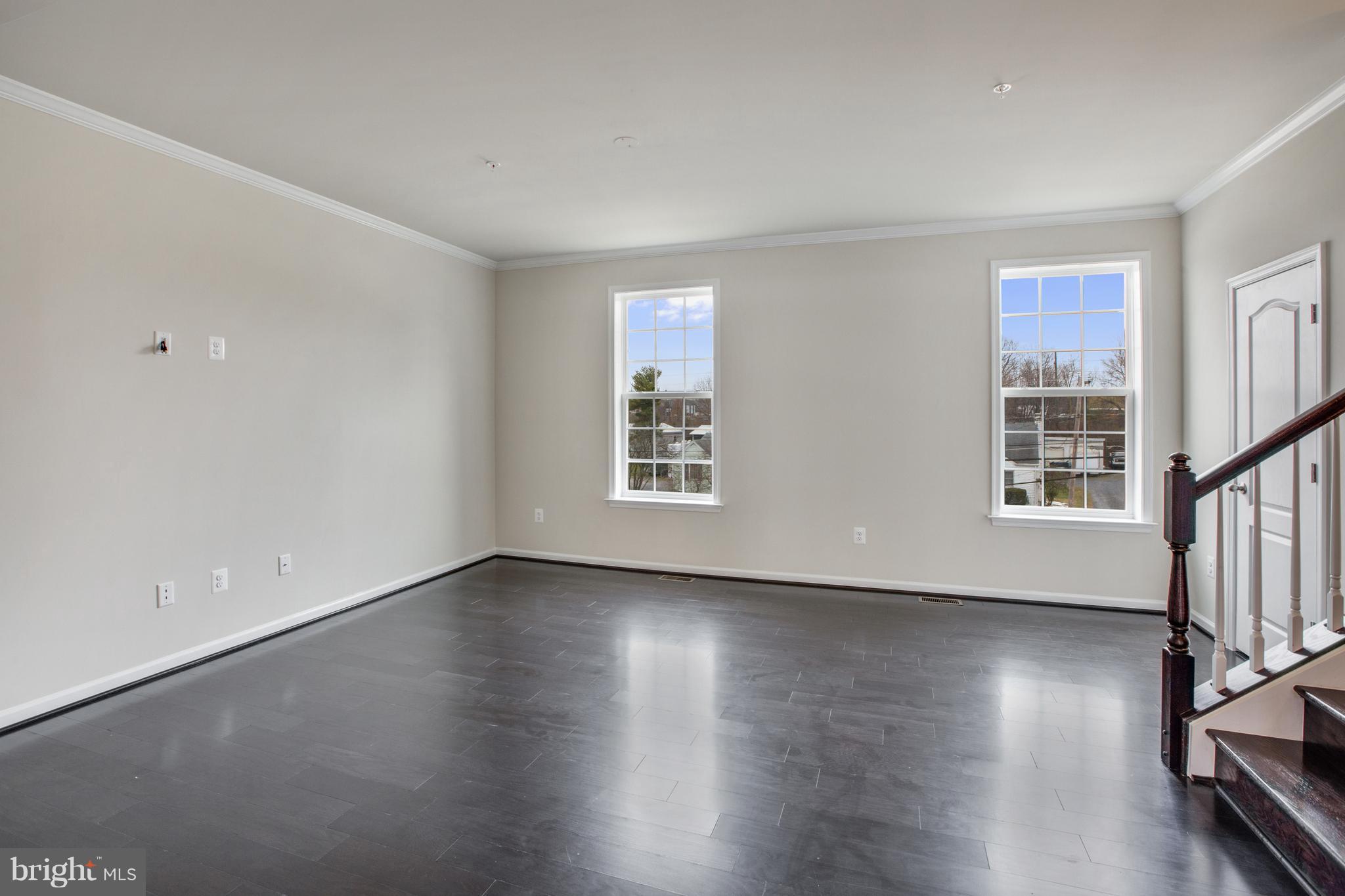7871 Wormans Mill Road Frederick, MD 21701 - Photo 11 of 30 a view of an empty room with wooden floor and a window