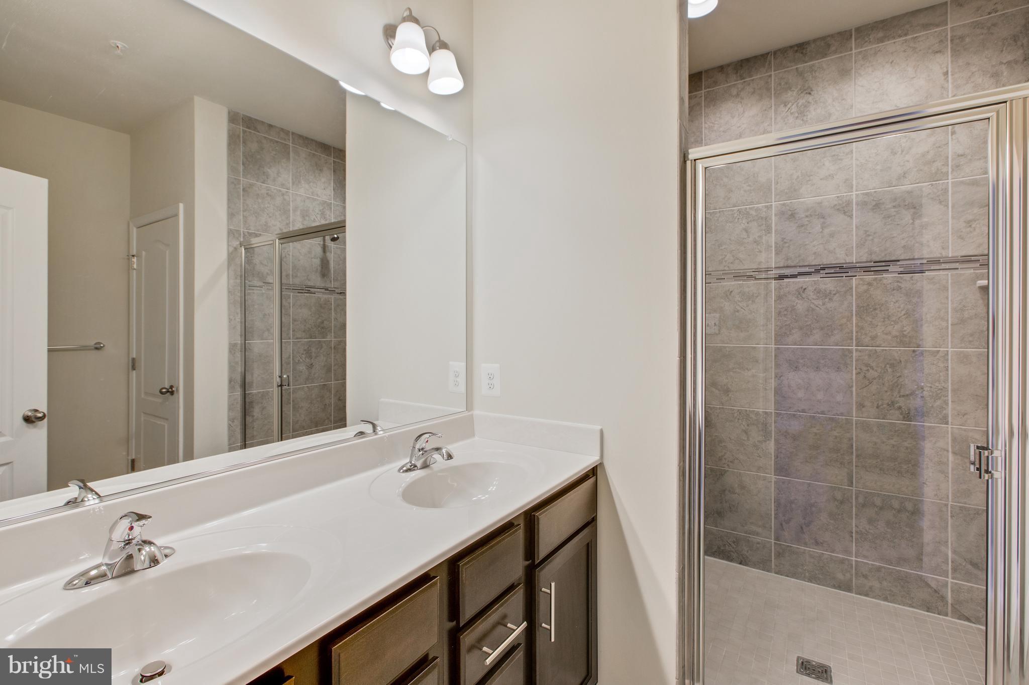 7871 Wormans Mill Road Frederick, MD 21701 - Photo 20 of 30 a bathroom with a sink and a mirror