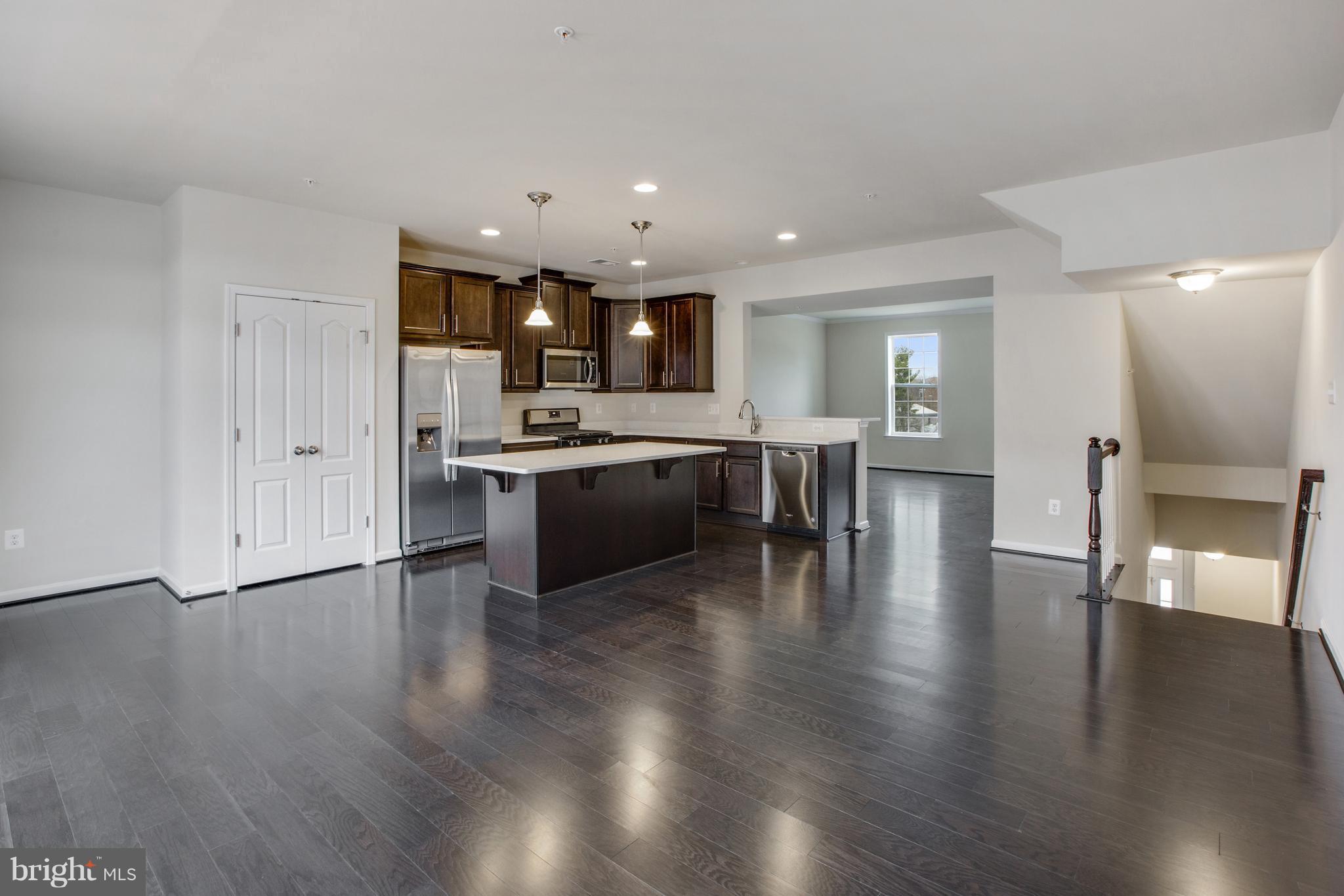 7871 Wormans Mill Road Frederick, MD 21701 - Photo 7 of 30 a view of a kitchen with cabinets and wooden floor