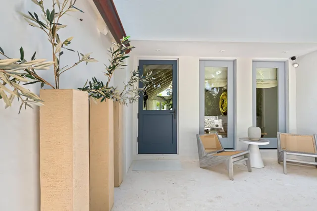 a view of a entryway with furniture and floor to ceiling window