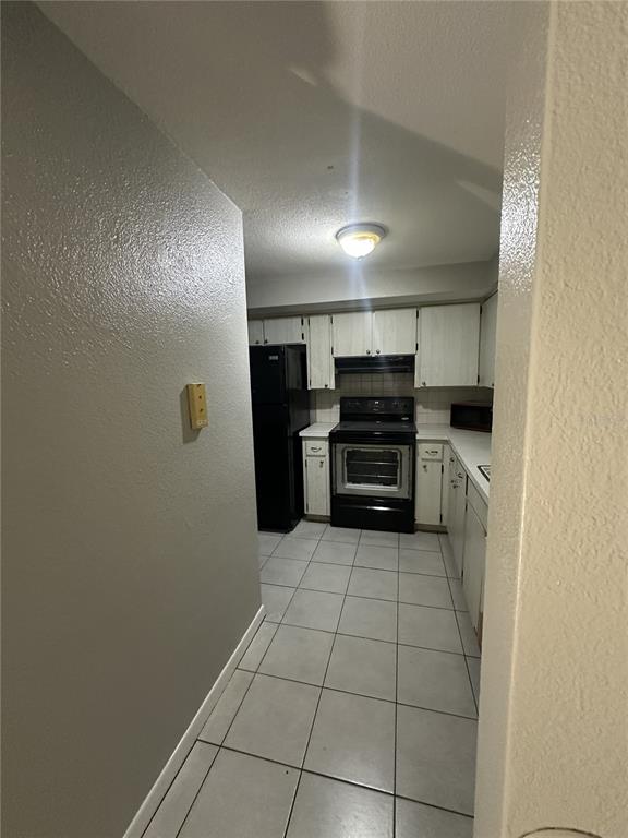 5509 Riddle Road Holiday, FL 34690 - Photo 6 of 13 a view of a electric appliances in kitchen and an empty room