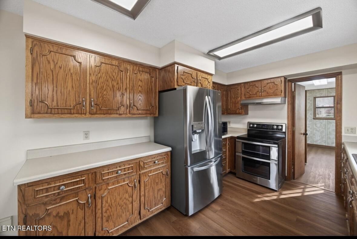 2400 Burgess Falls Road Cookeville, TN 38506 - Photo 20 of 41 a kitchen with stainless steel appliances granite countertop a refrigerator stove and sink