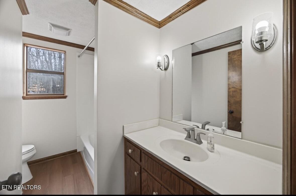 2400 Burgess Falls Road Cookeville, TN 38506 - Photo 23 of 41 a bathroom with a granite countertop sink toilet and shower