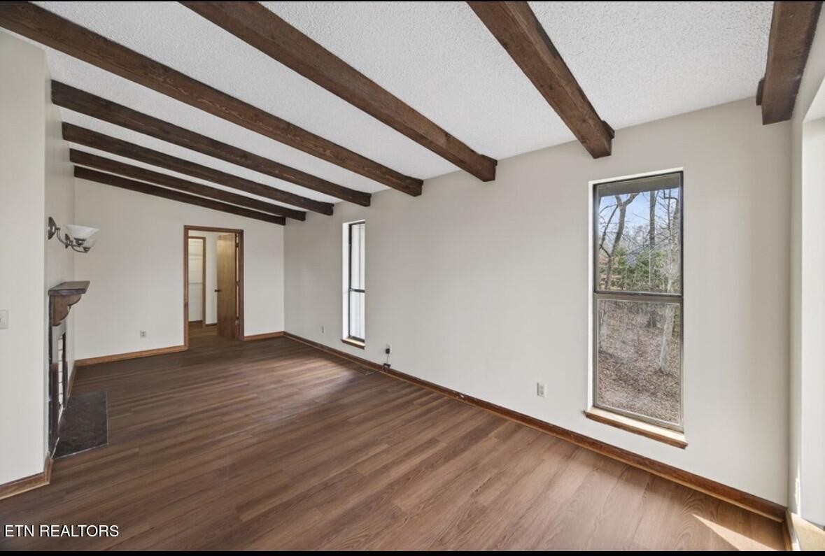 2400 Burgess Falls Road Cookeville, TN 38506 - Photo 30 of 41 a view of an empty room with wooden floor and windows