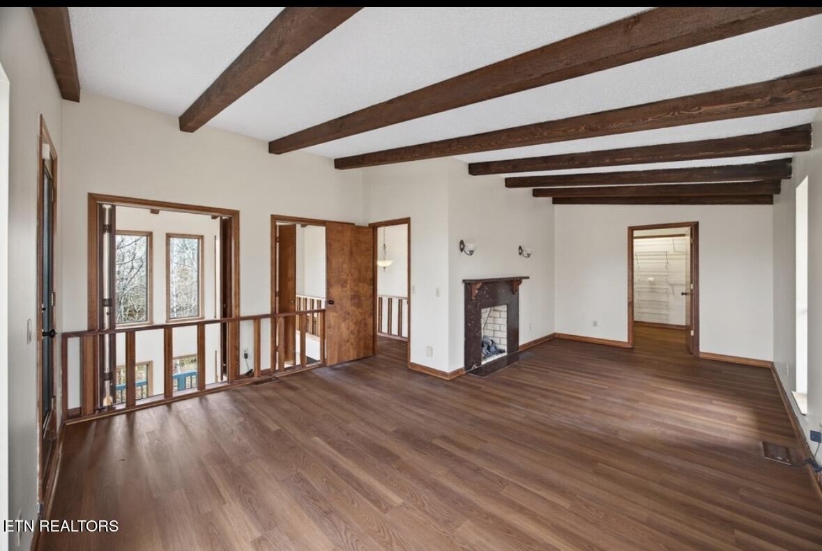 2400 Burgess Falls Road Cookeville, TN 38506 - Photo 32 of 41 a view of empty room with wooden floor and fireplace