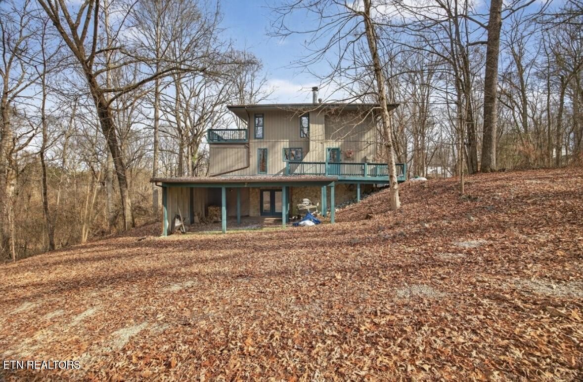 2400 Burgess Falls Road Cookeville, TN 38506 - Photo 5 of 41 a front view of a house with a garden