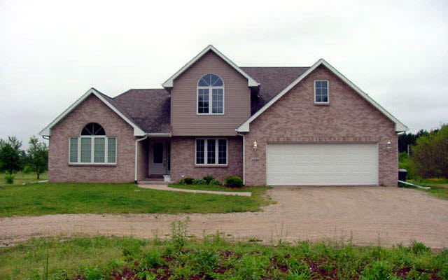 3230 Yale Bridge Road Rockton, IL 61072 - Photo 1 of 1 a front view of a house with a garden and yard