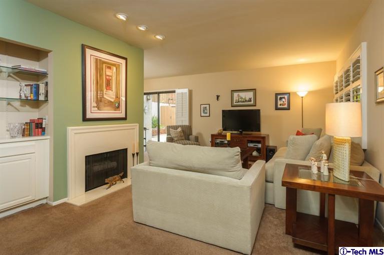 1445 Valley View Road, Unit 5 Glendale, CA 91202 - Photo 2 of 19 a living room with furniture a fireplace and a flat screen tv