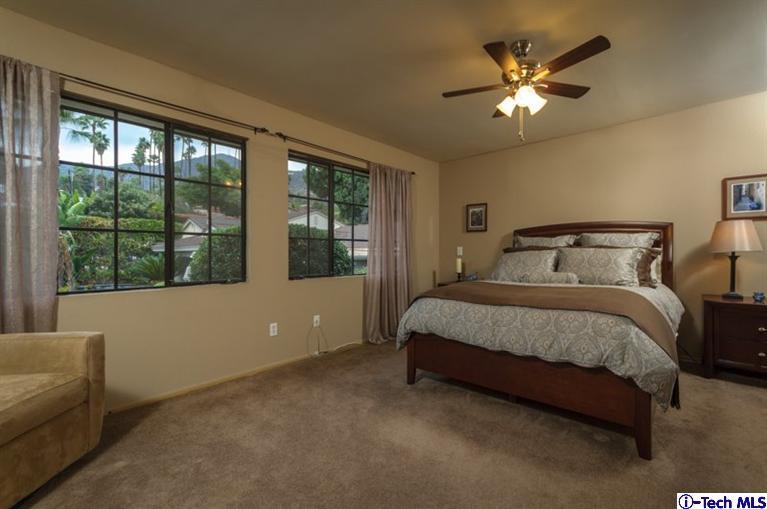 1445 Valley View Road, Unit 5 Glendale, CA 91202 - Photo 16 of 19 a bedroom with a large bed and a large window