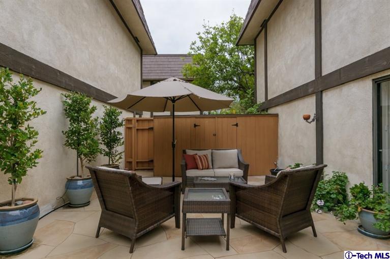 1445 Valley View Road, Unit 5 Glendale, CA 91202 - Photo 18 of 19 a backyard of a house with table and chairs